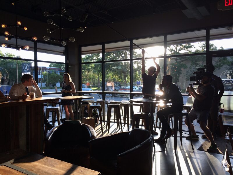 Bar scene — full crew on set