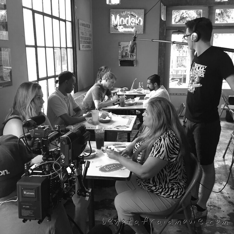 Restaurant scene — full cast at the table