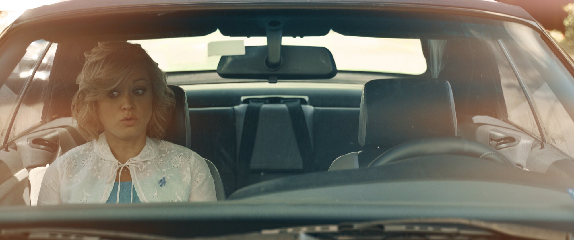 Maria alone in the car