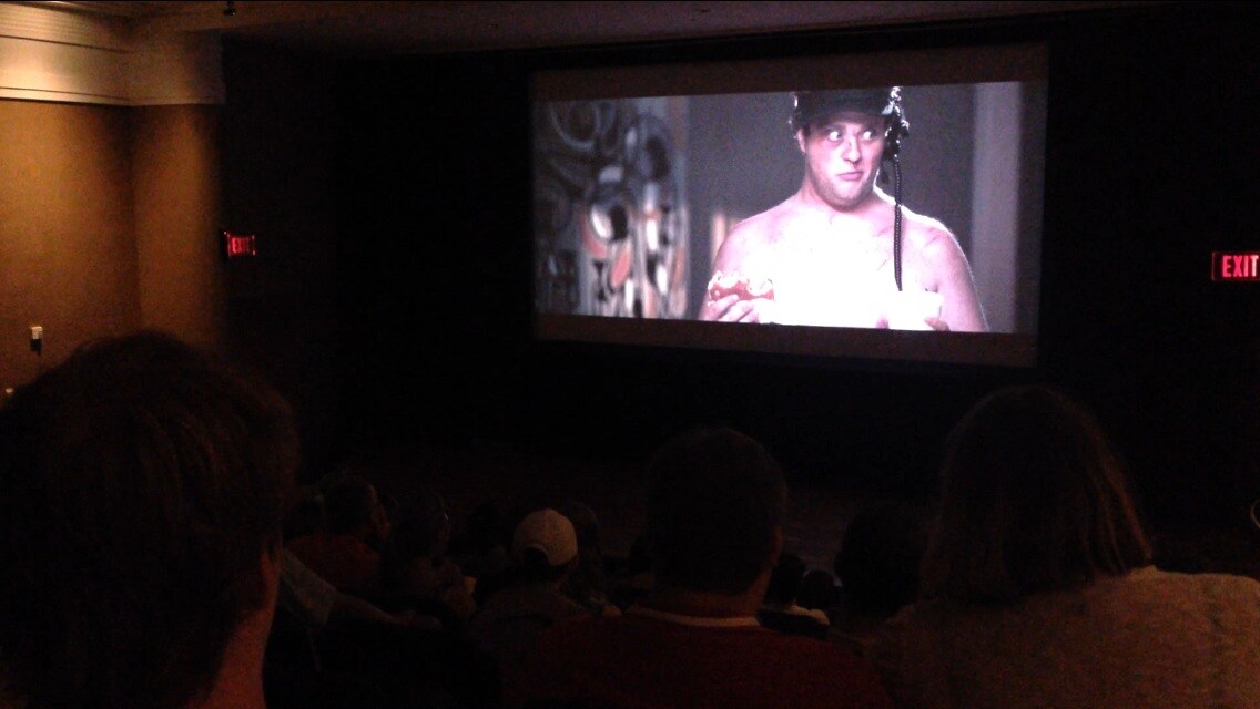 Audience watching Coming Out at festival screening