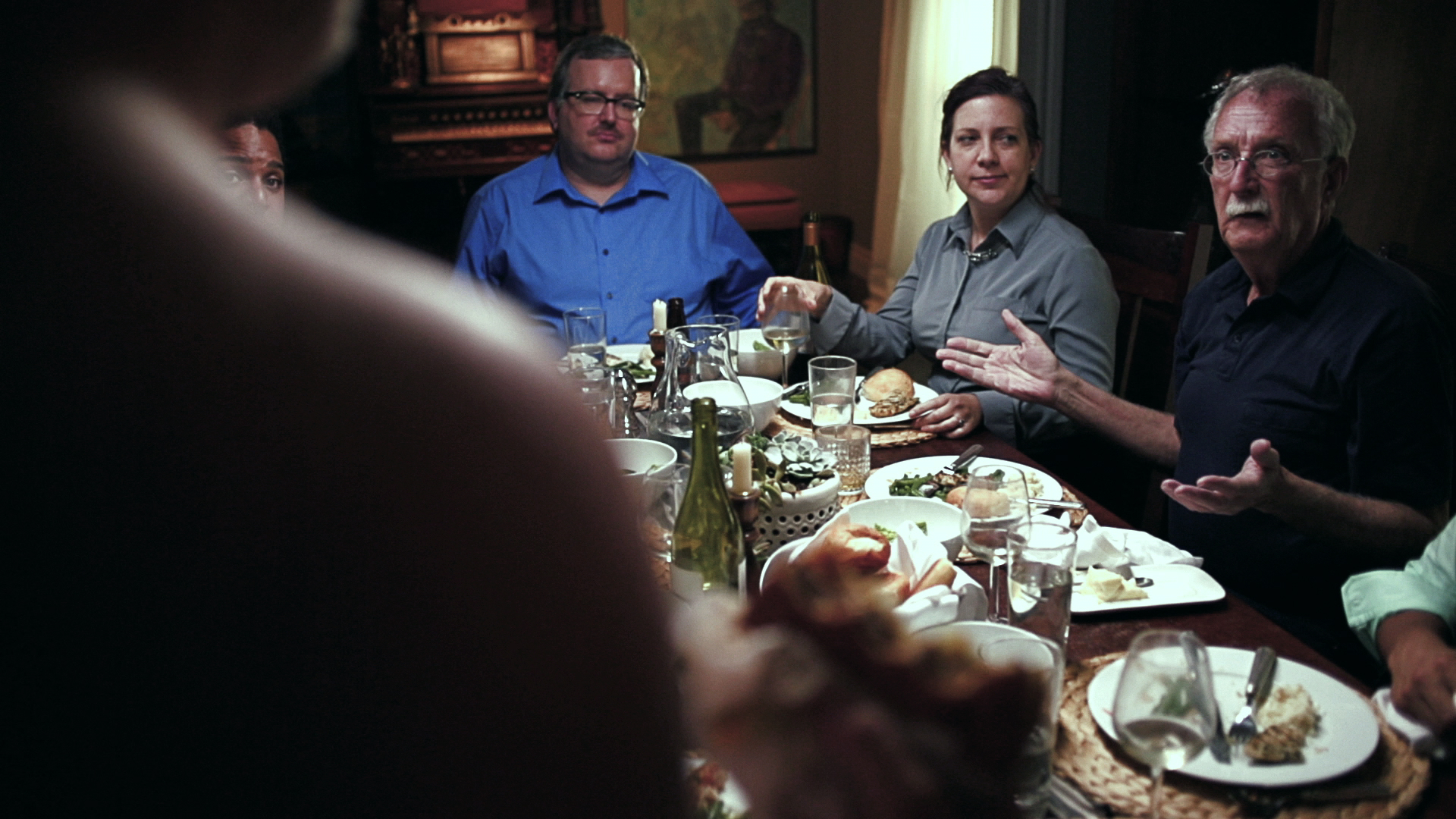 Film still — family dinner table