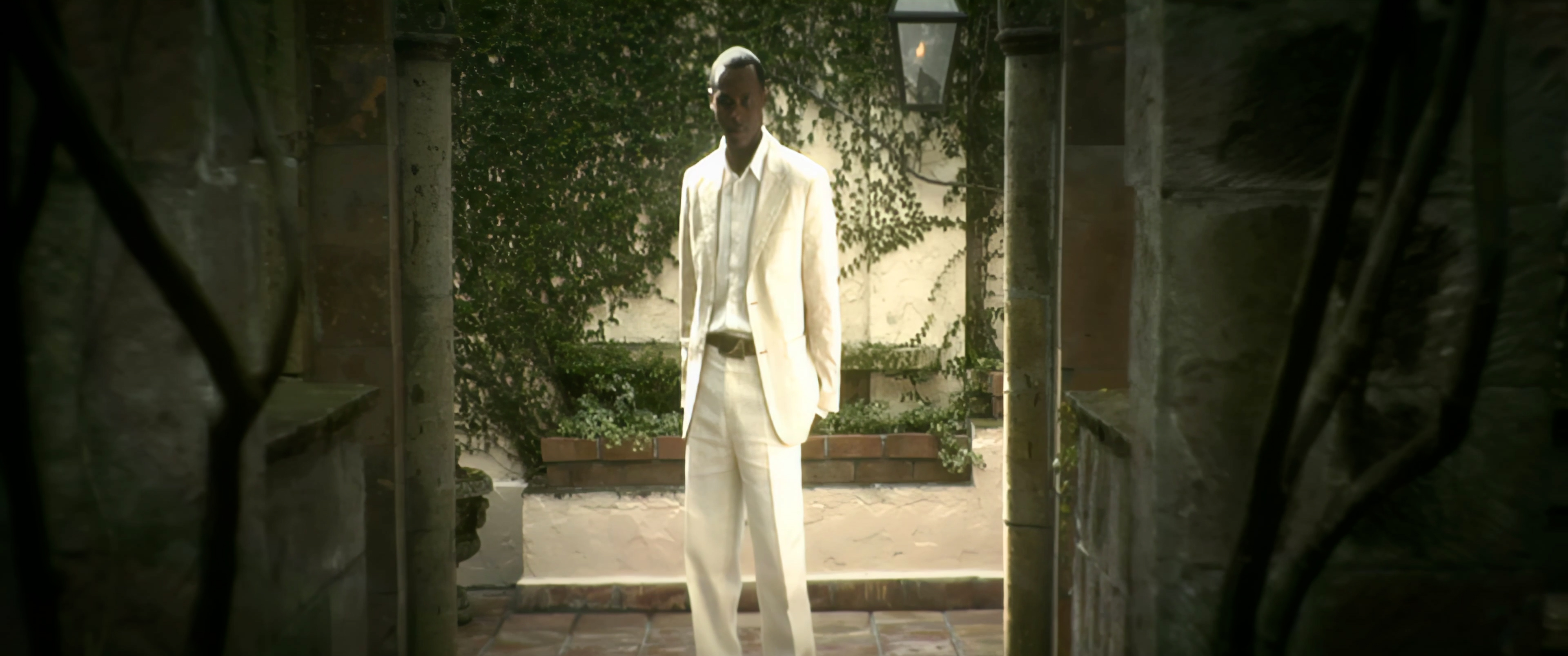 Micah Stampley in a white suit at the Italian villa