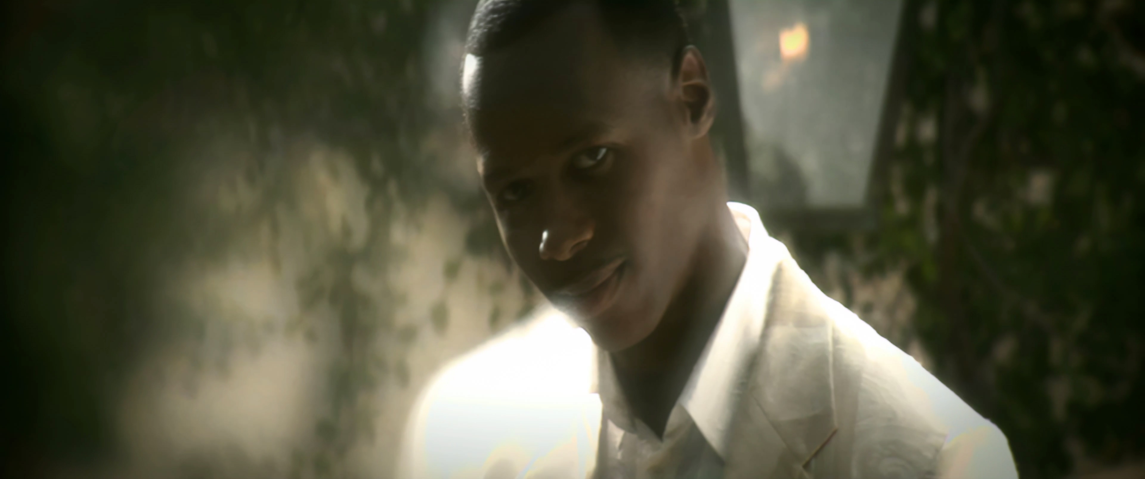 Micah Stampley close-up at the villa, lens flare